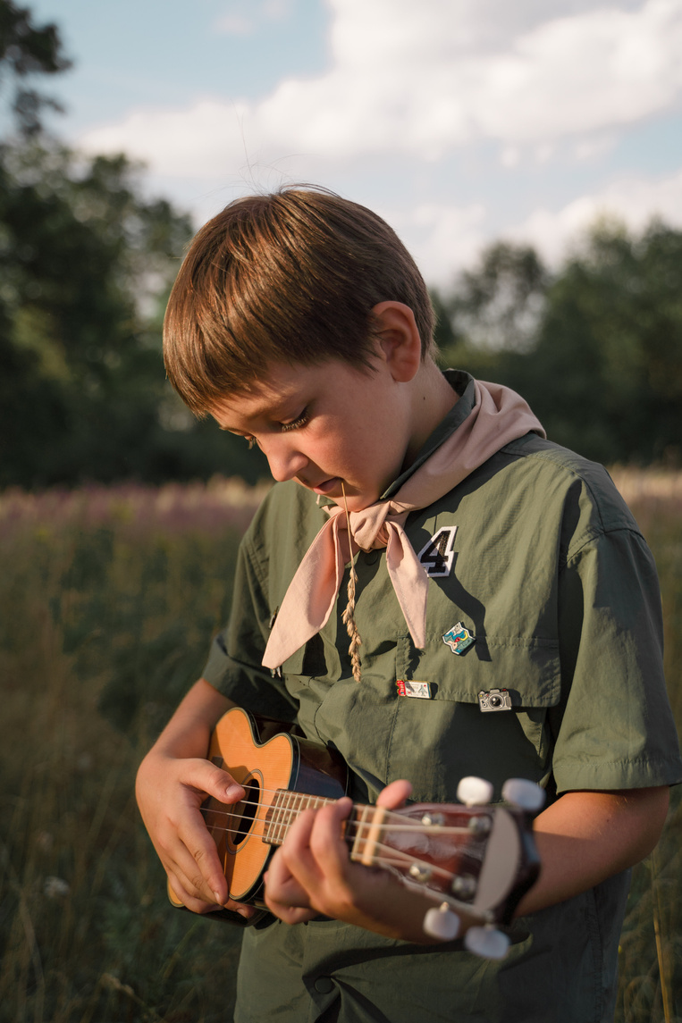 A Kid Playing the Ukulele