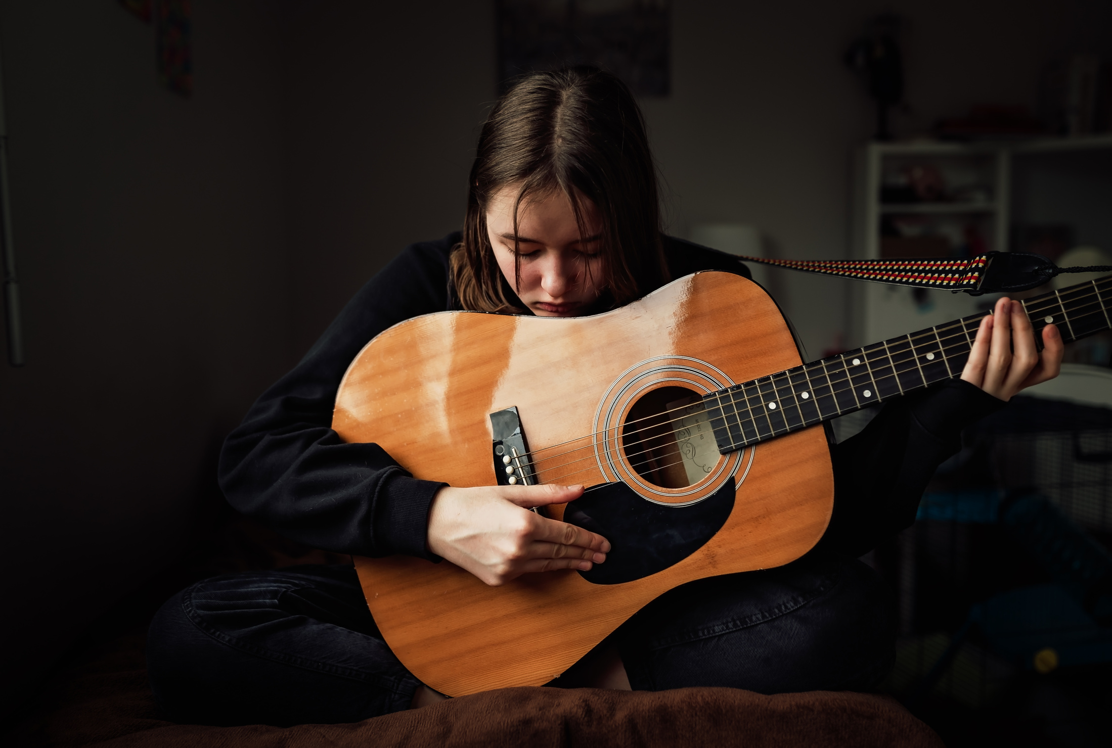 Sad Teen Girl Playing the Guitar 